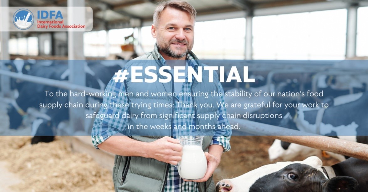 essential worker farmer with cow and milk