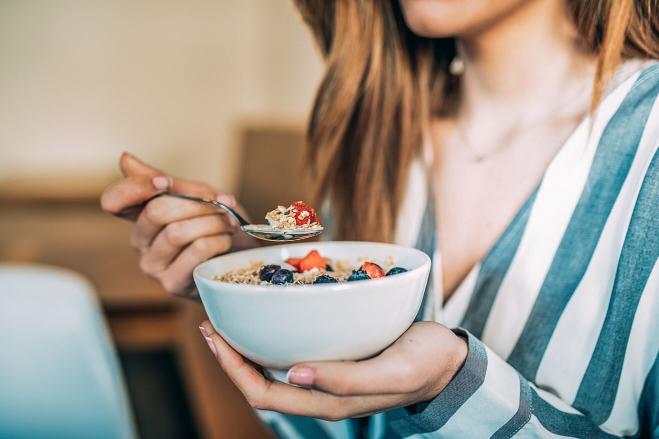 woman eating cereal