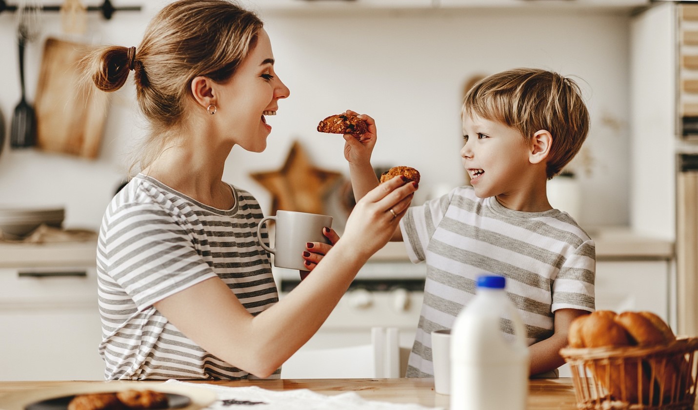 woman and child eating baked goods