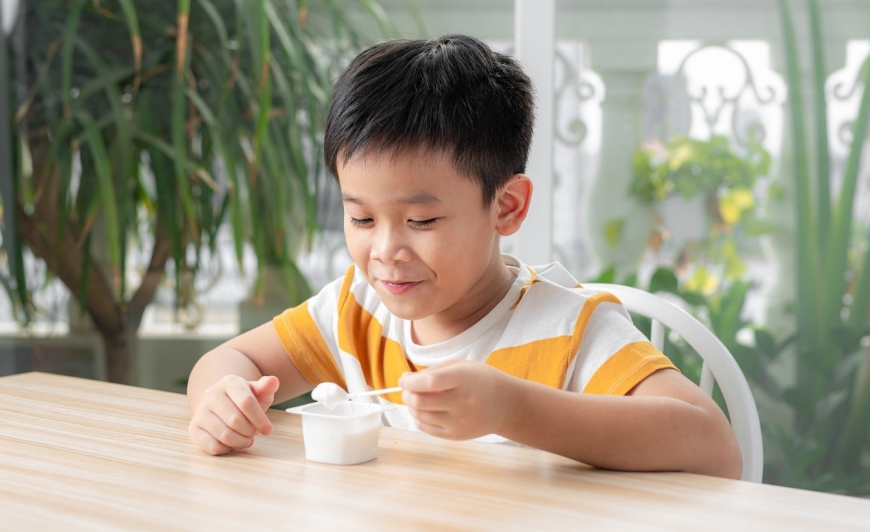 boy eating yogurt