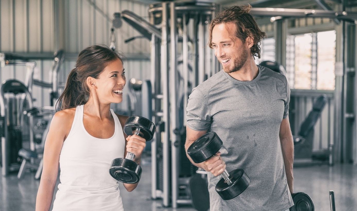 man and woman in gym after energy drinks