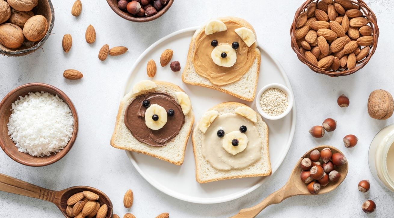bread with spread and bowls of nuts