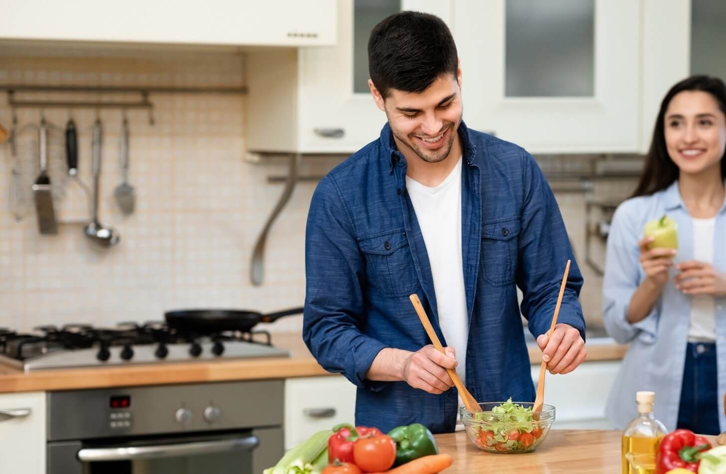 Man and woman cooking in the kitchen