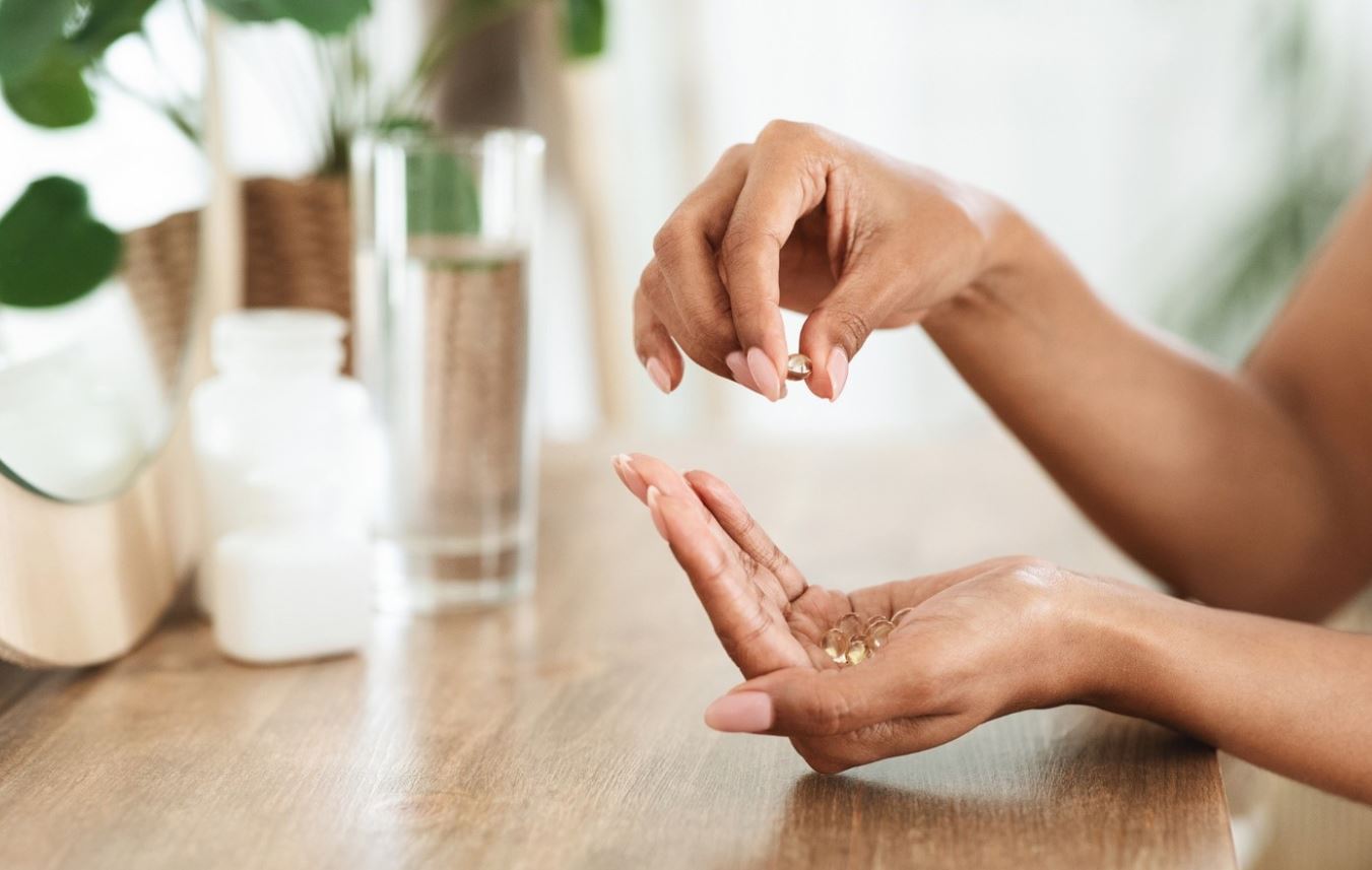 person holding supplements