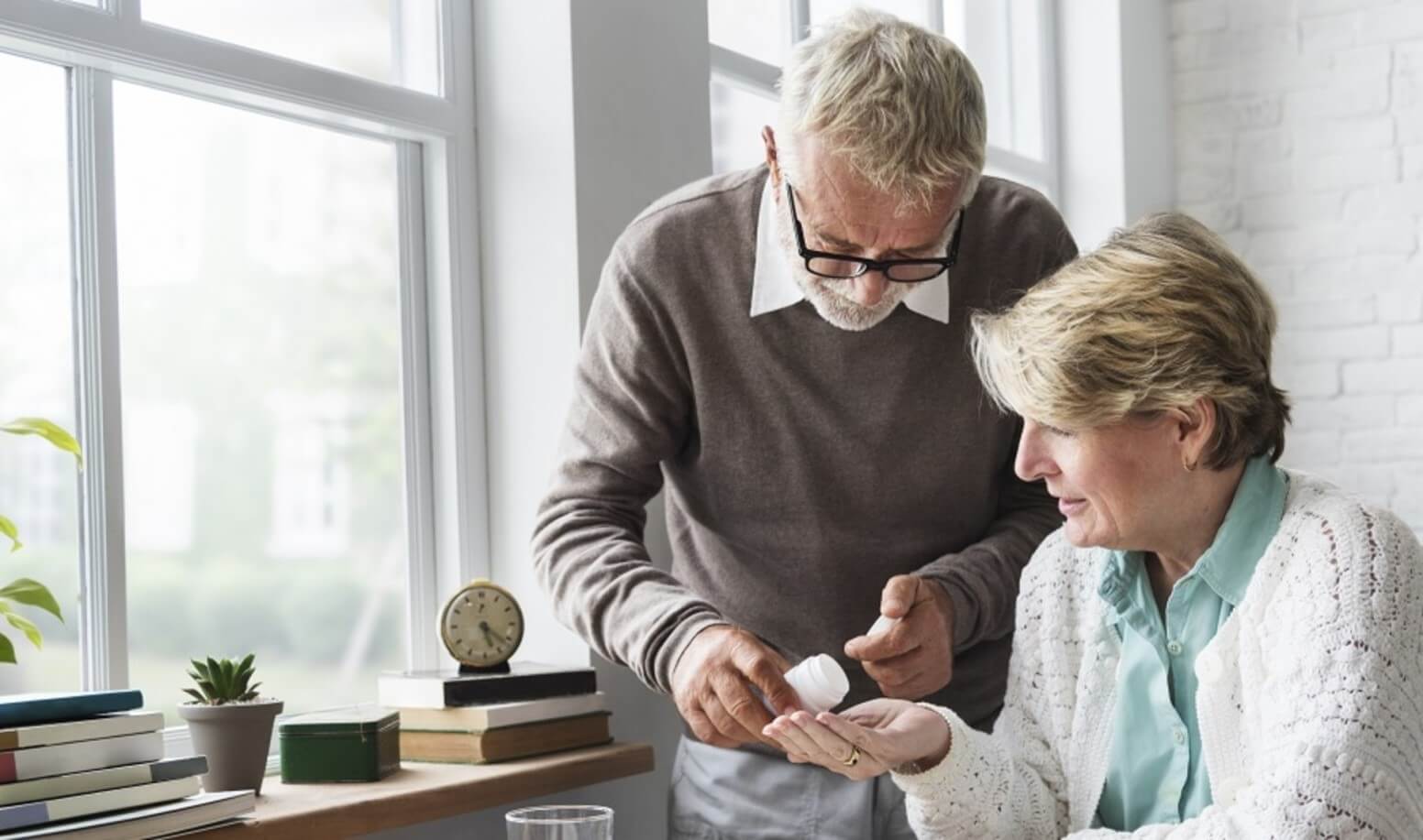 man giving a woman supplements