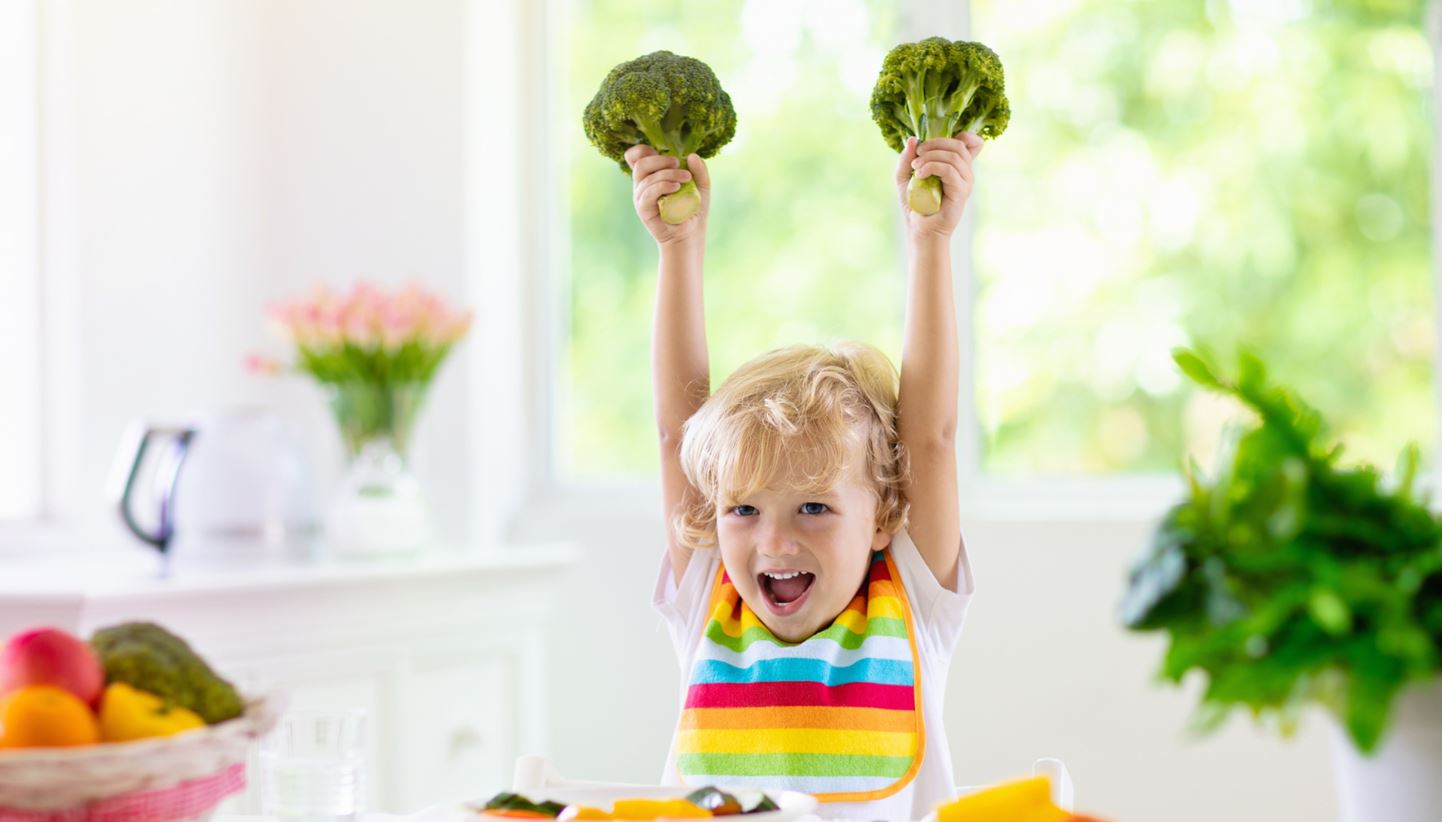 kid with broccoli