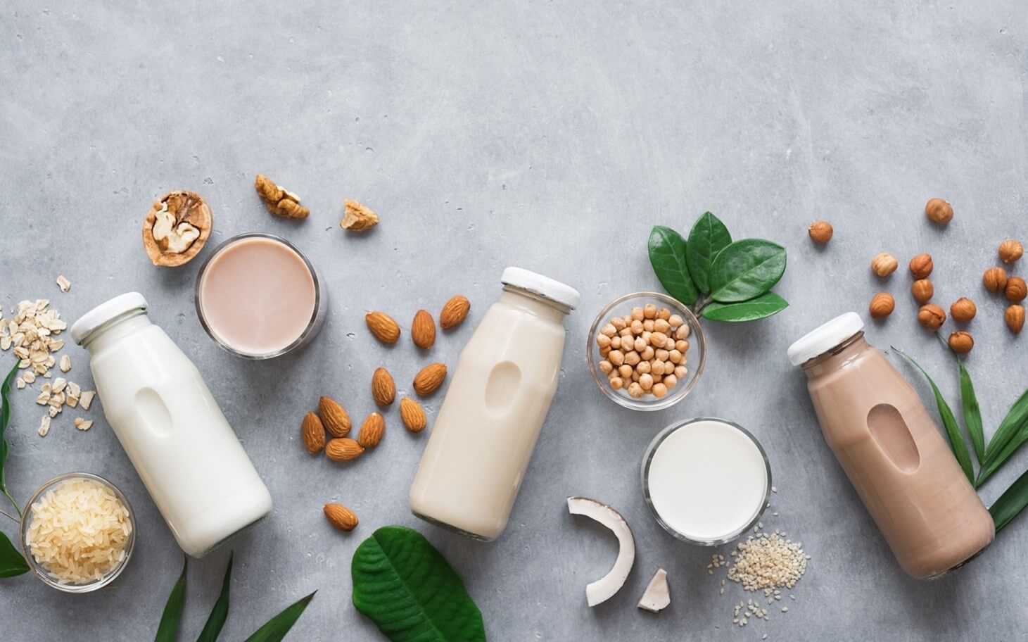 bottles of milk and nuts on table