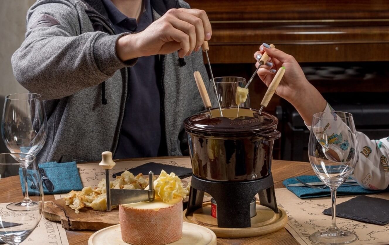 fondue on table with people 
