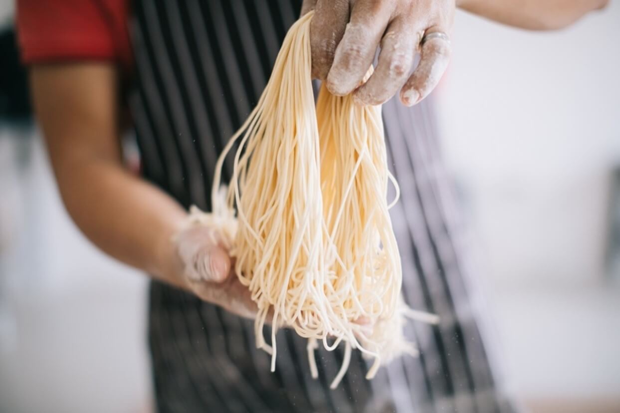 man making pasta