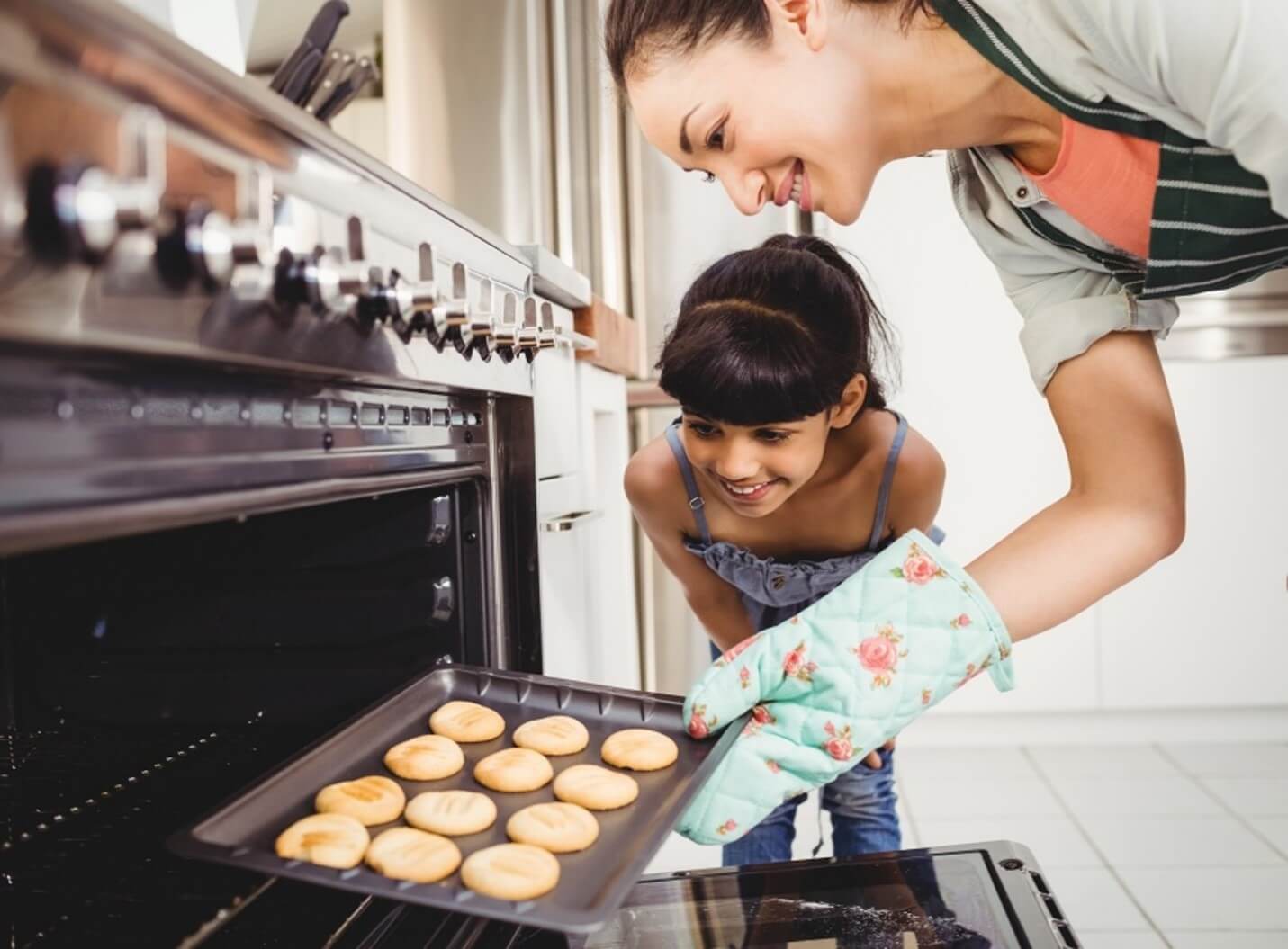 mom and child baking cookies