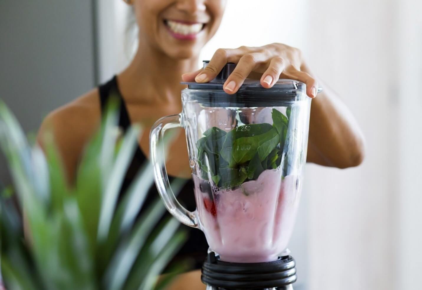 woman making a smoothie