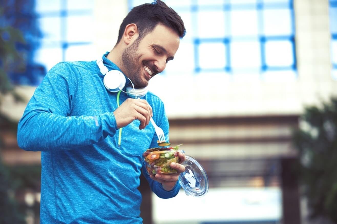 man eating outside