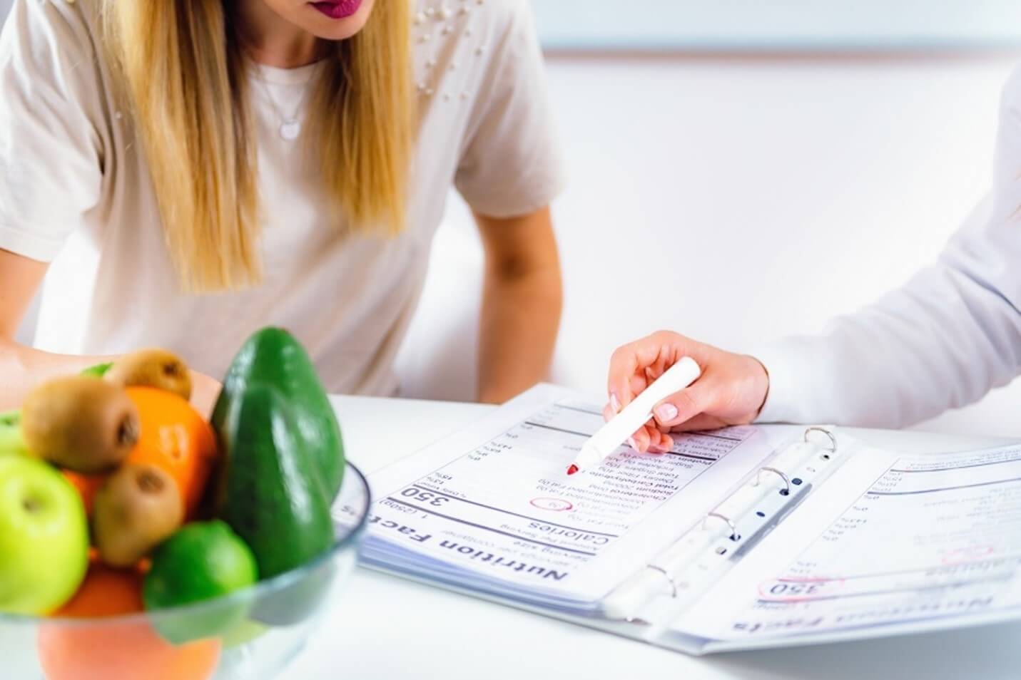 person pointing at nutrition label