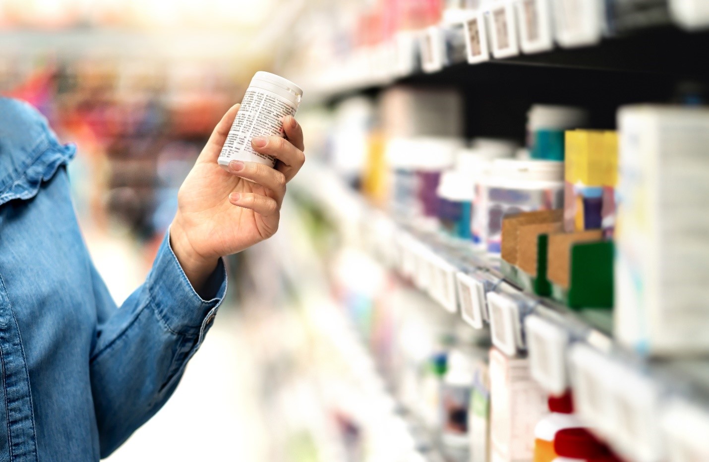 person holding pill bottle