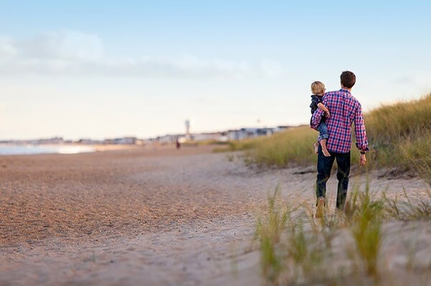 father and son at beach