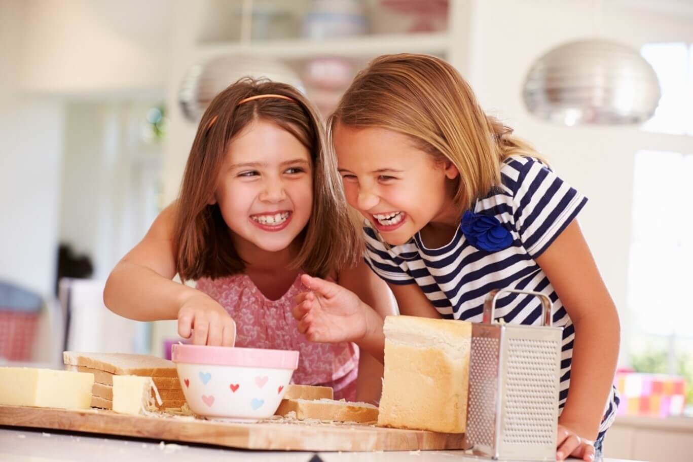 two girls eating snacks