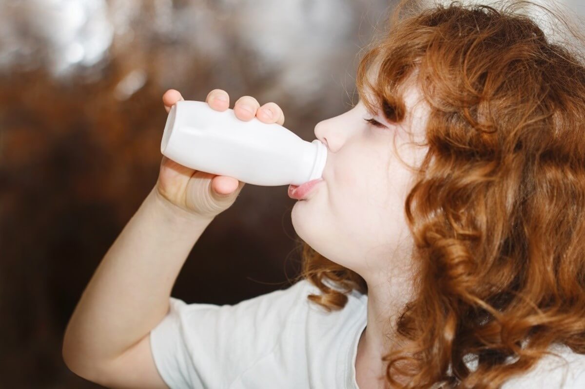 girl drinking yogurt