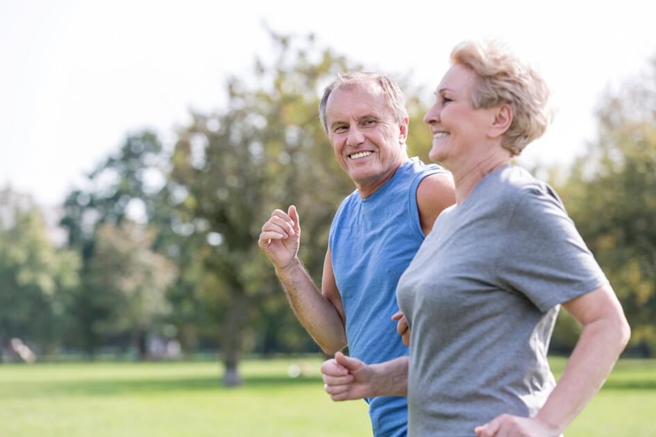 senior couple running