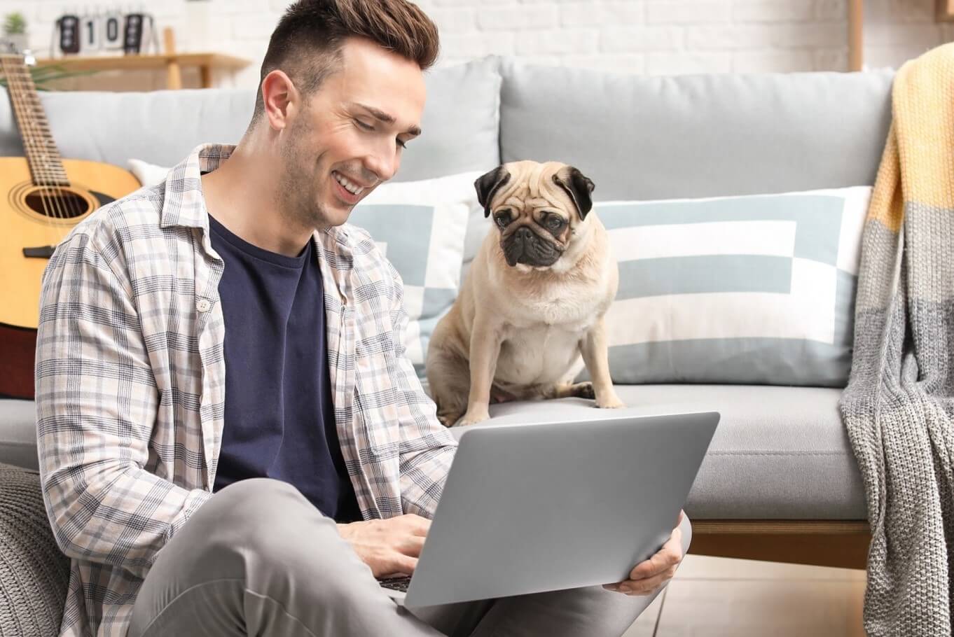 Man at computer with dog