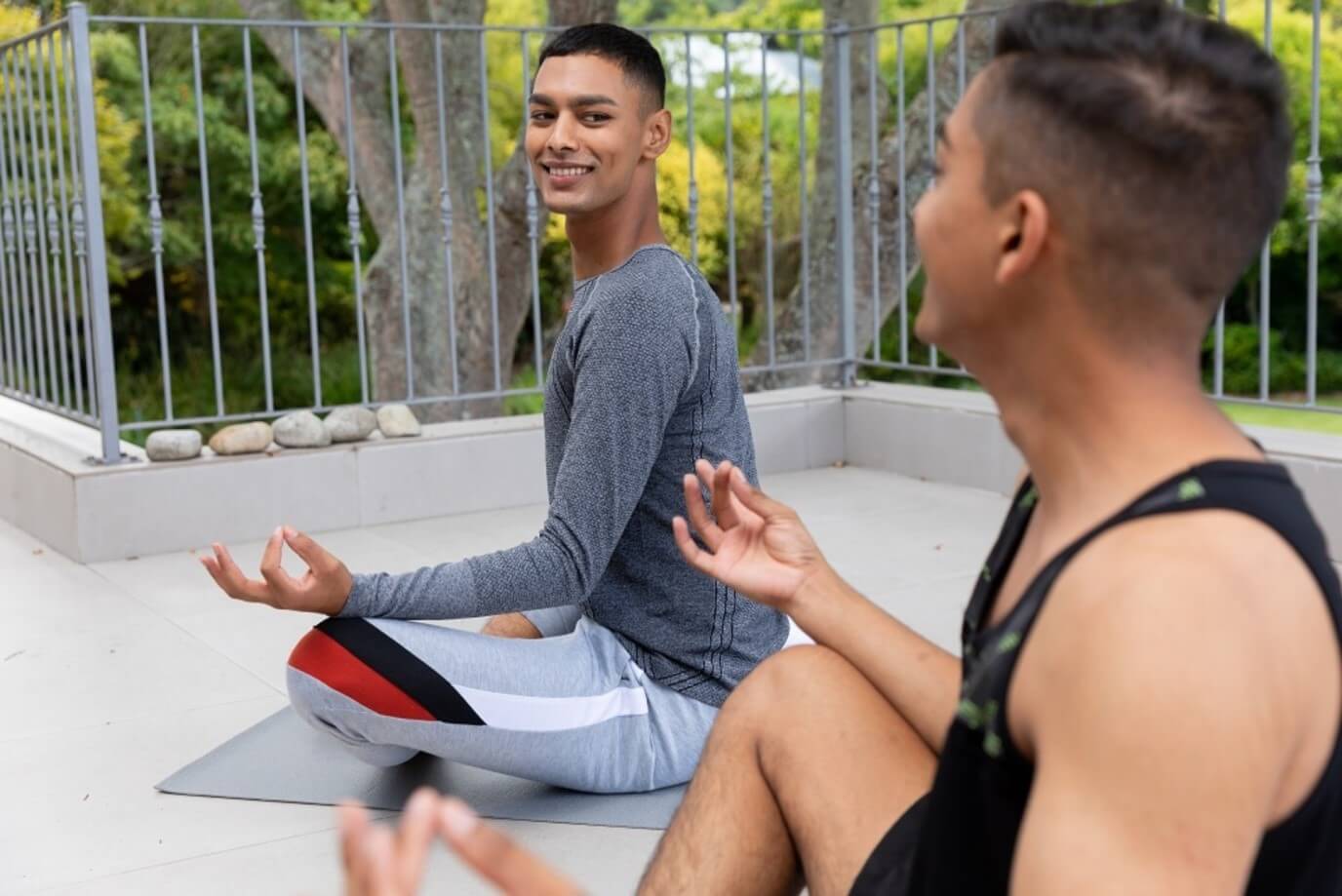 two men doing yoga