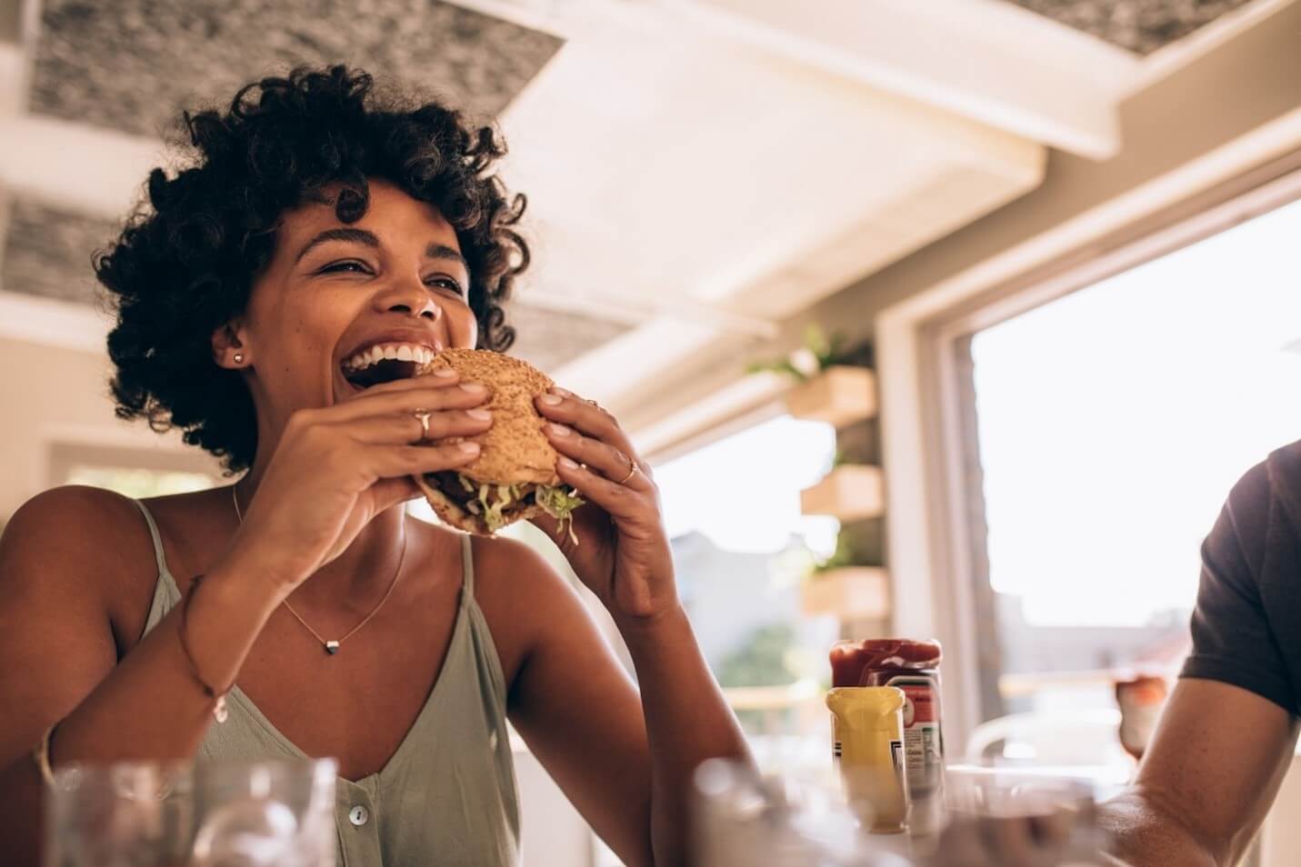 woman eating burger