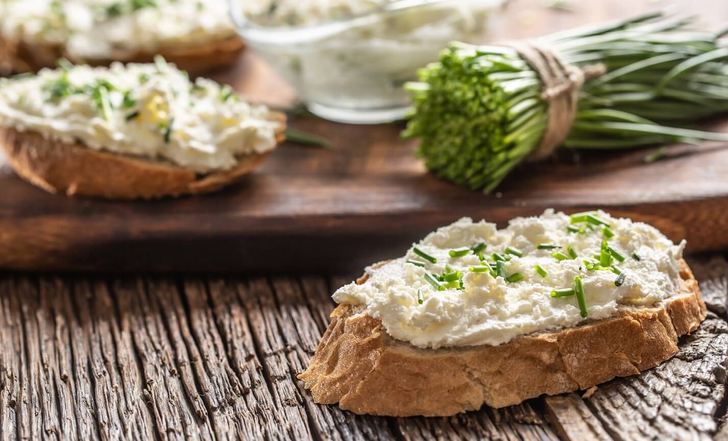 cream cheese and chives on bread