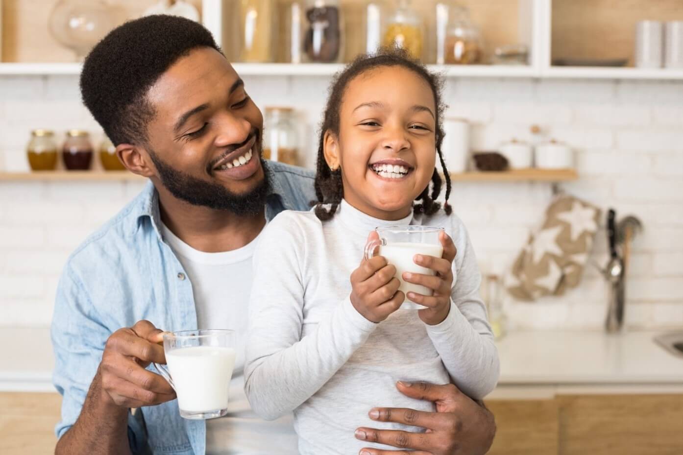 dad and daughter drinking milk