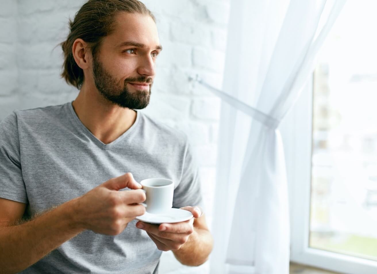 man holding a cup