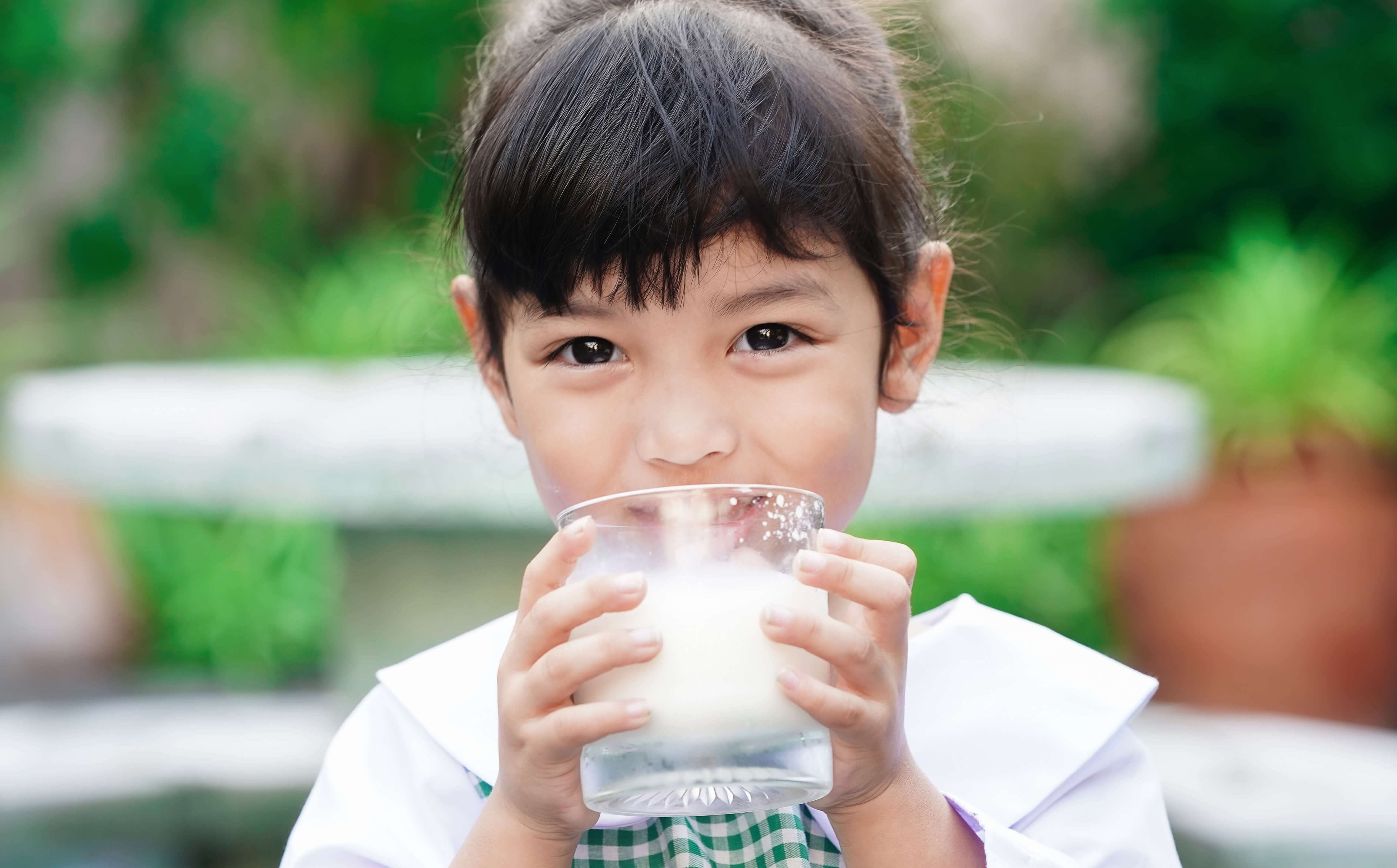 child drinking milk