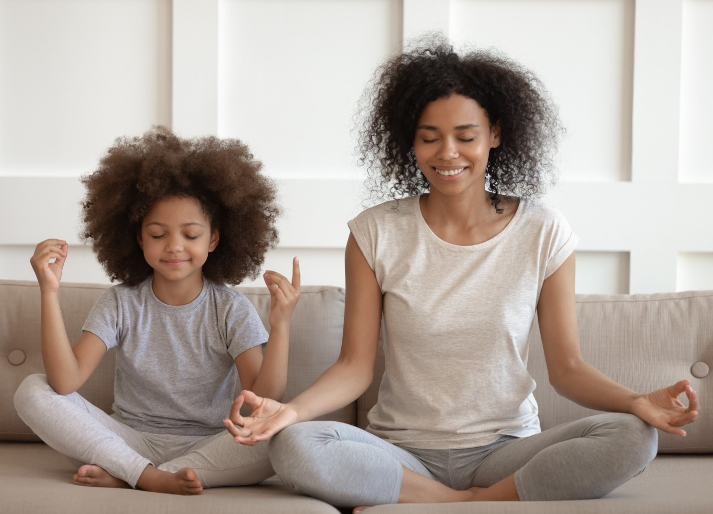 mom and daughter doing yoga