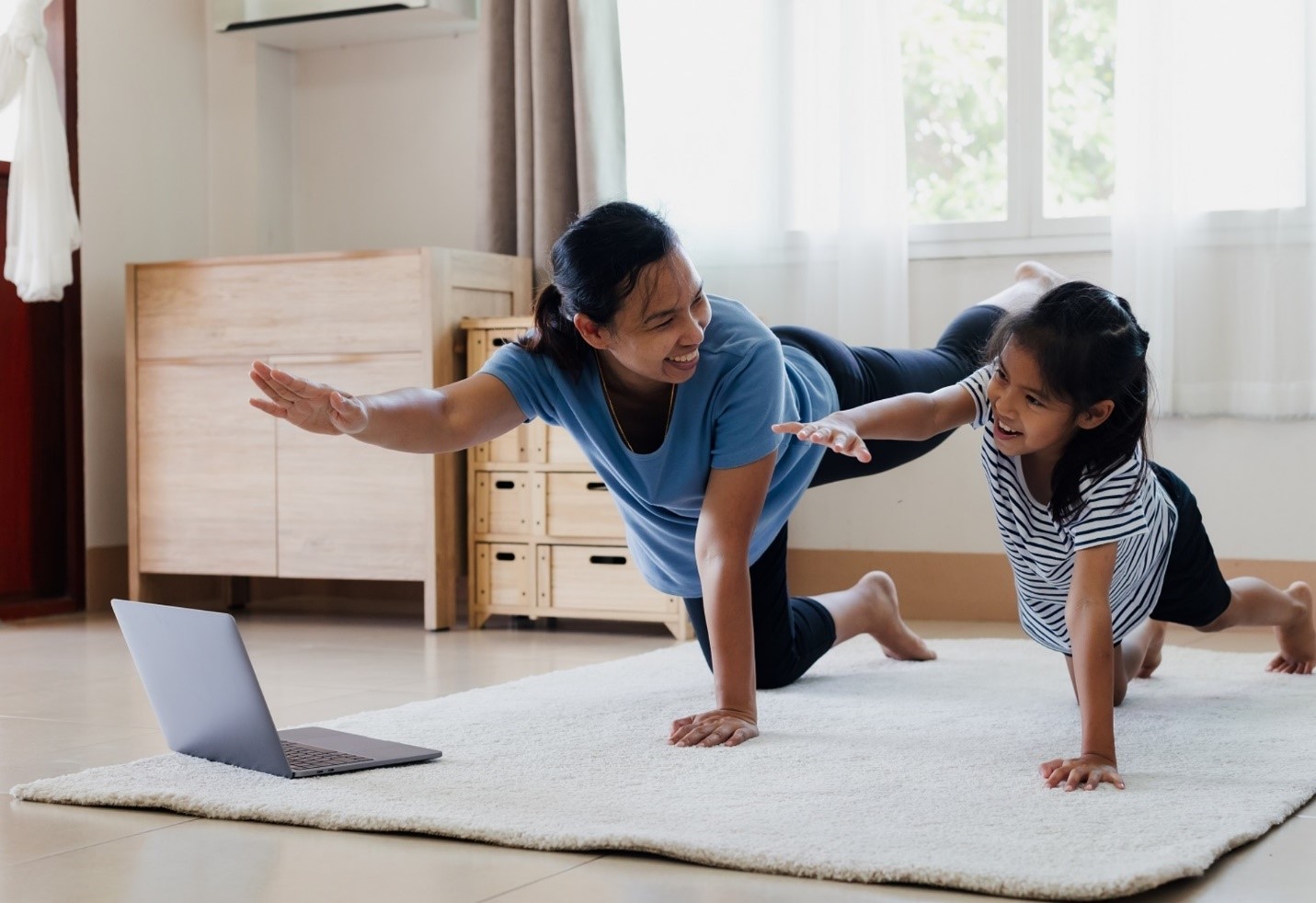 mom and daughter doing yoga