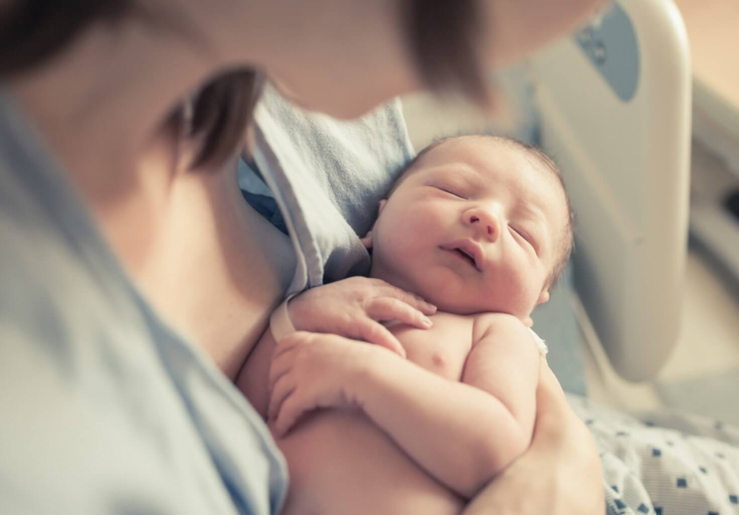 mom holding baby