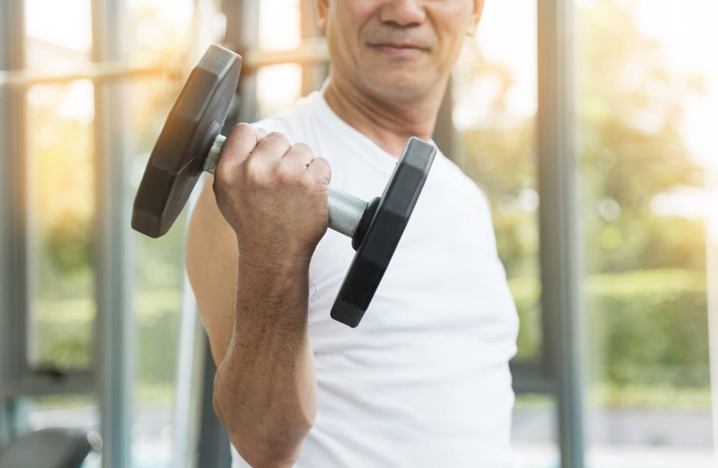 senior man lifting weight