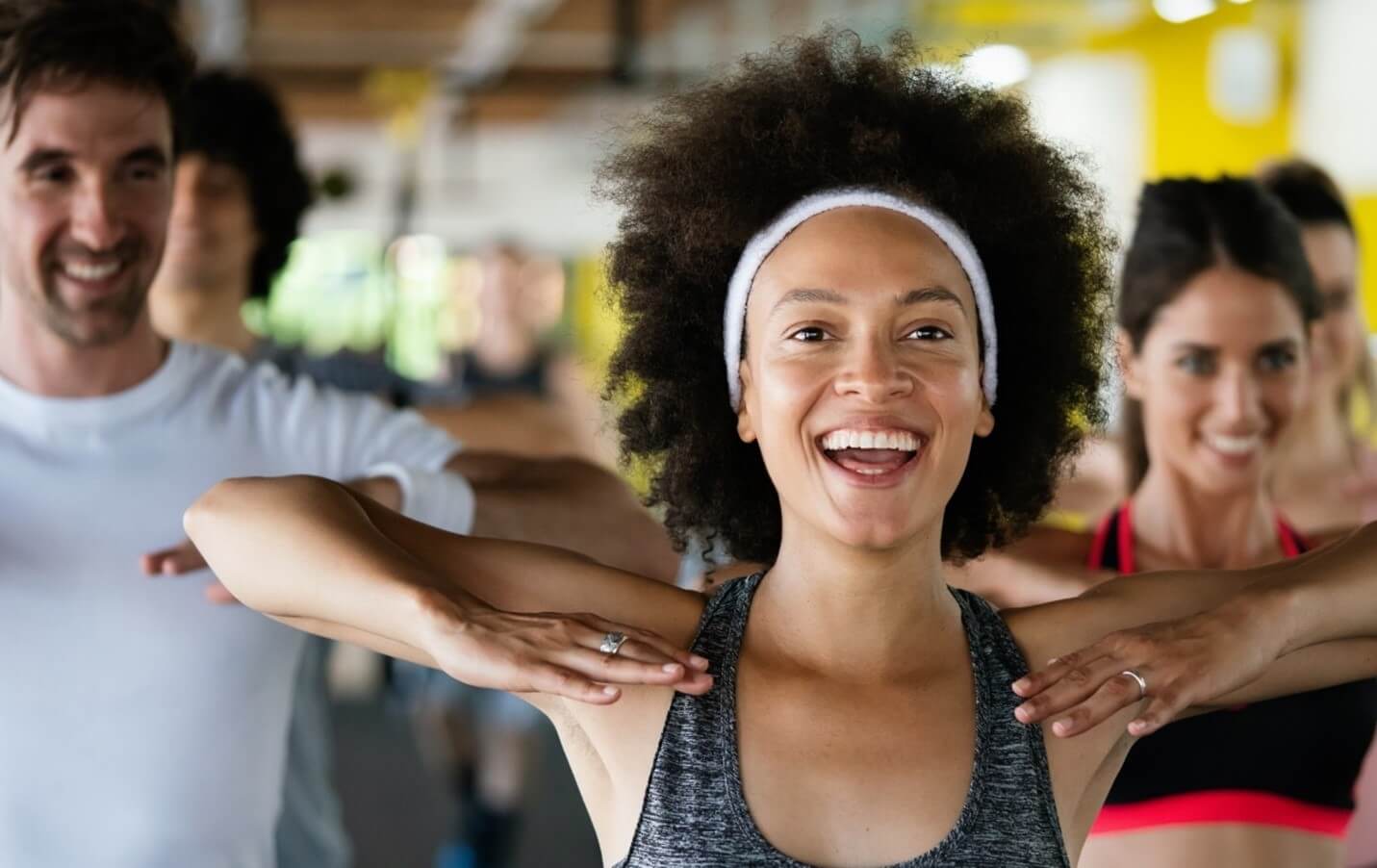 woman stretching in class