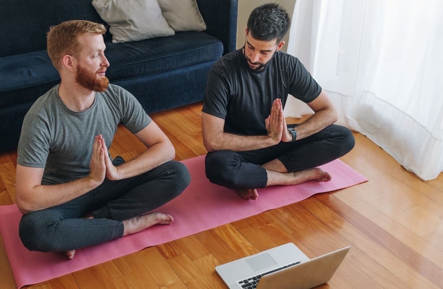 two men doing yoga