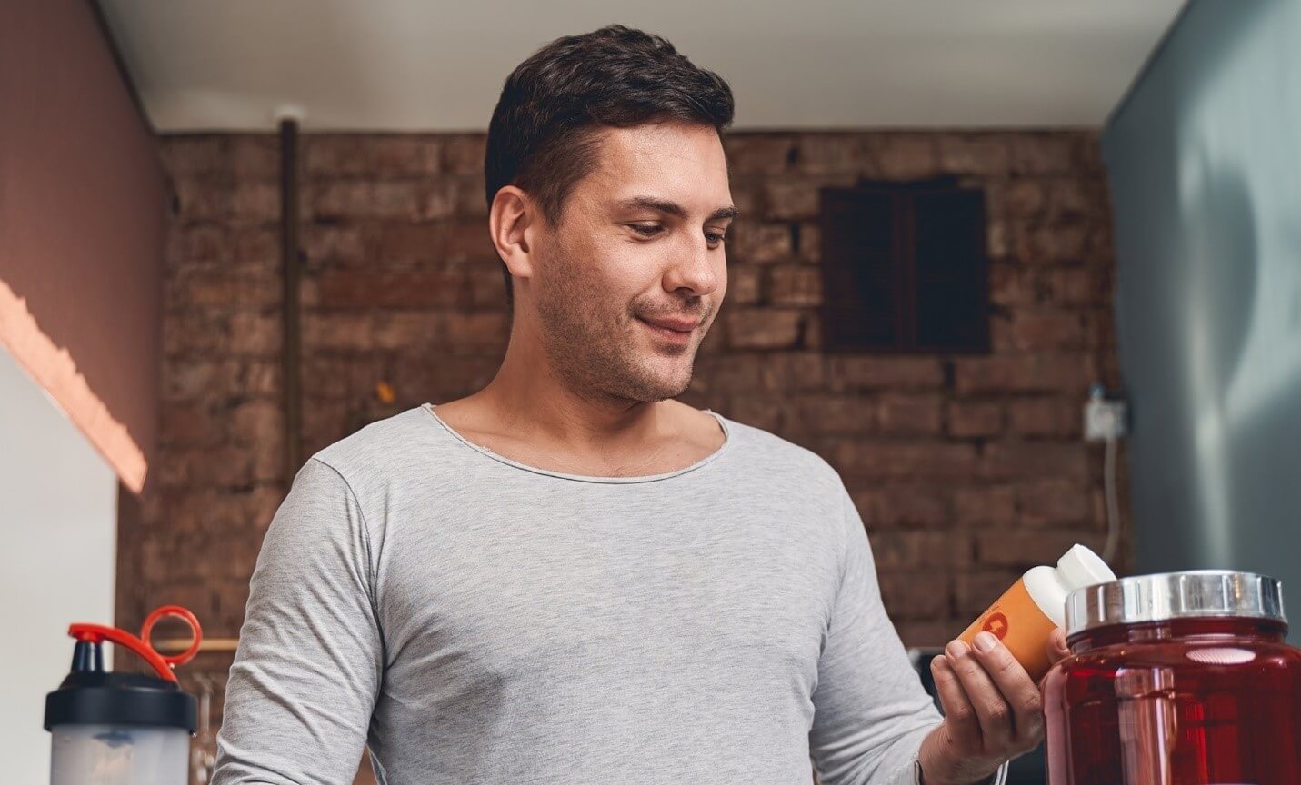 man looking at supplements