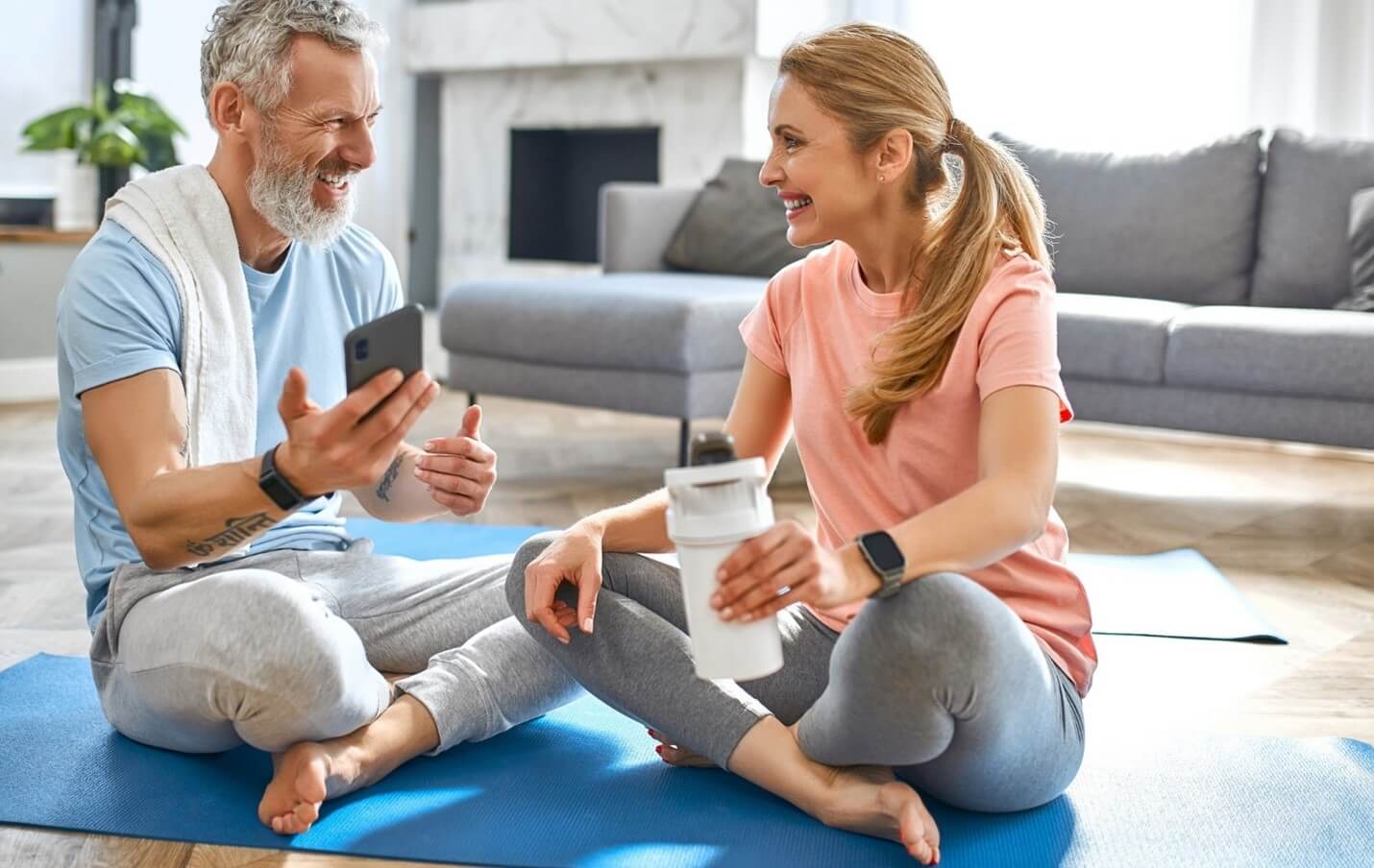 man and woman on yoga mat