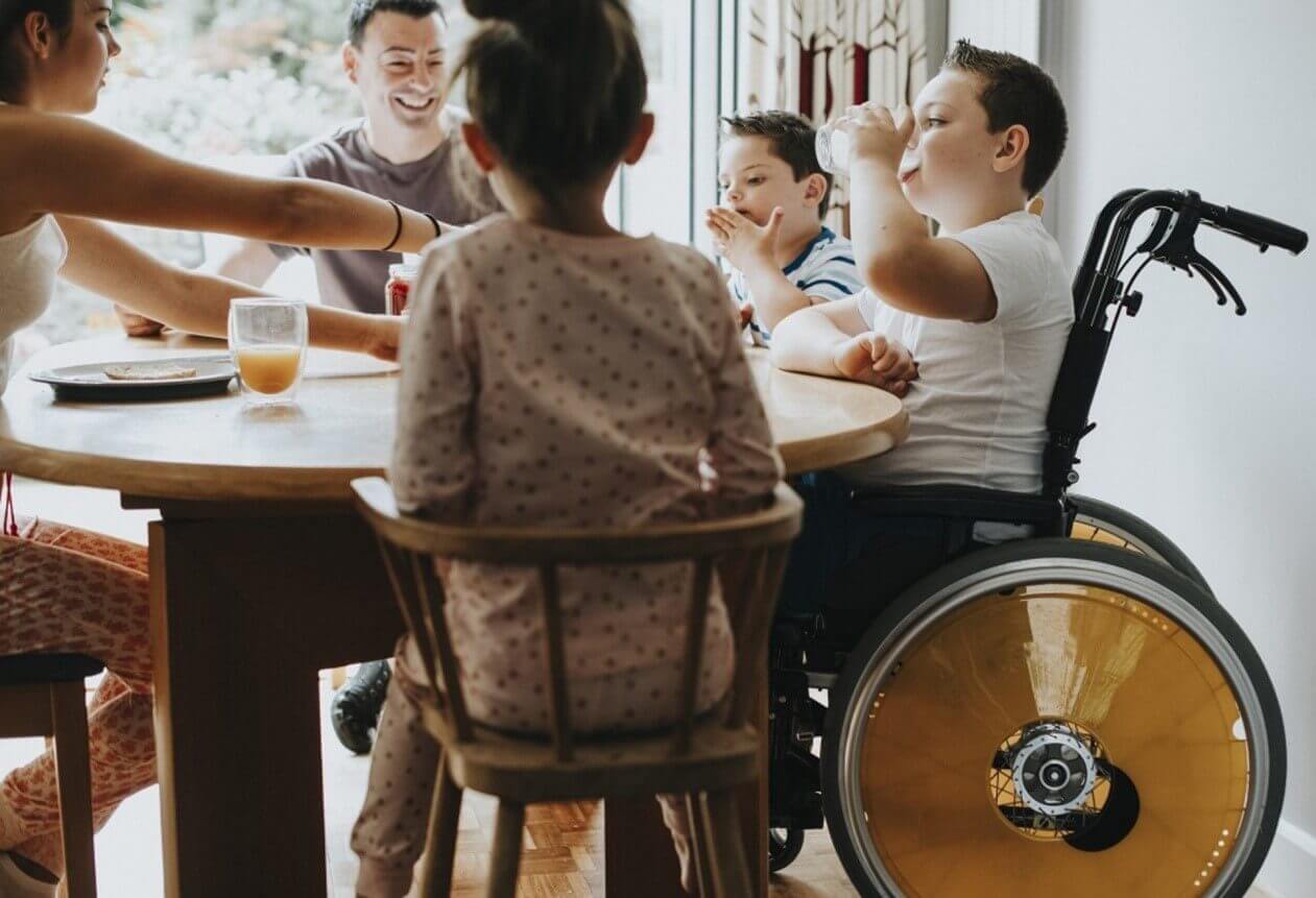 fam sitting at table