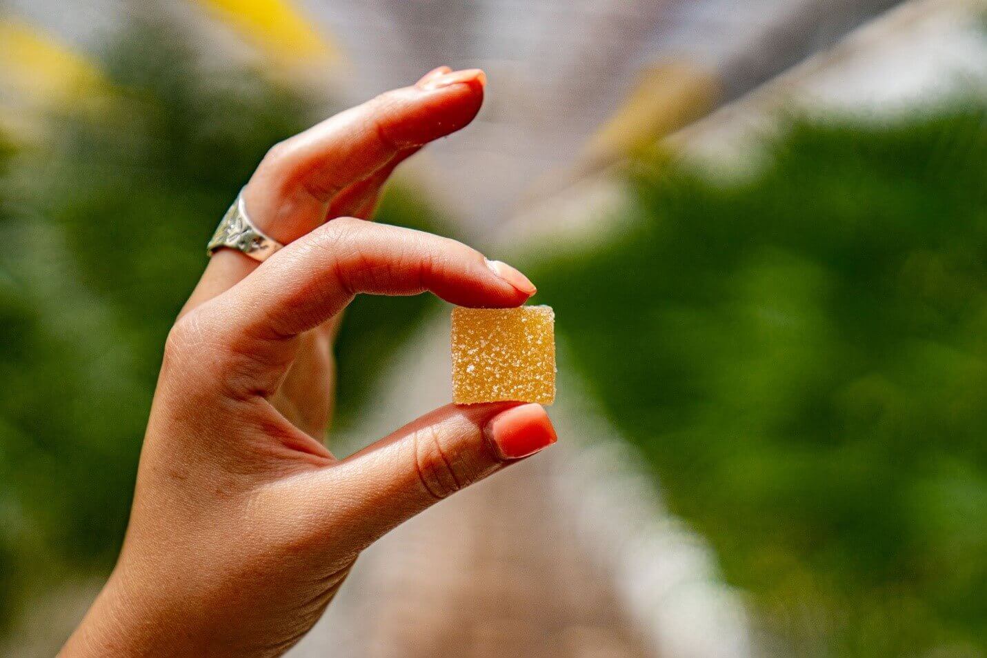 woman holding gummy