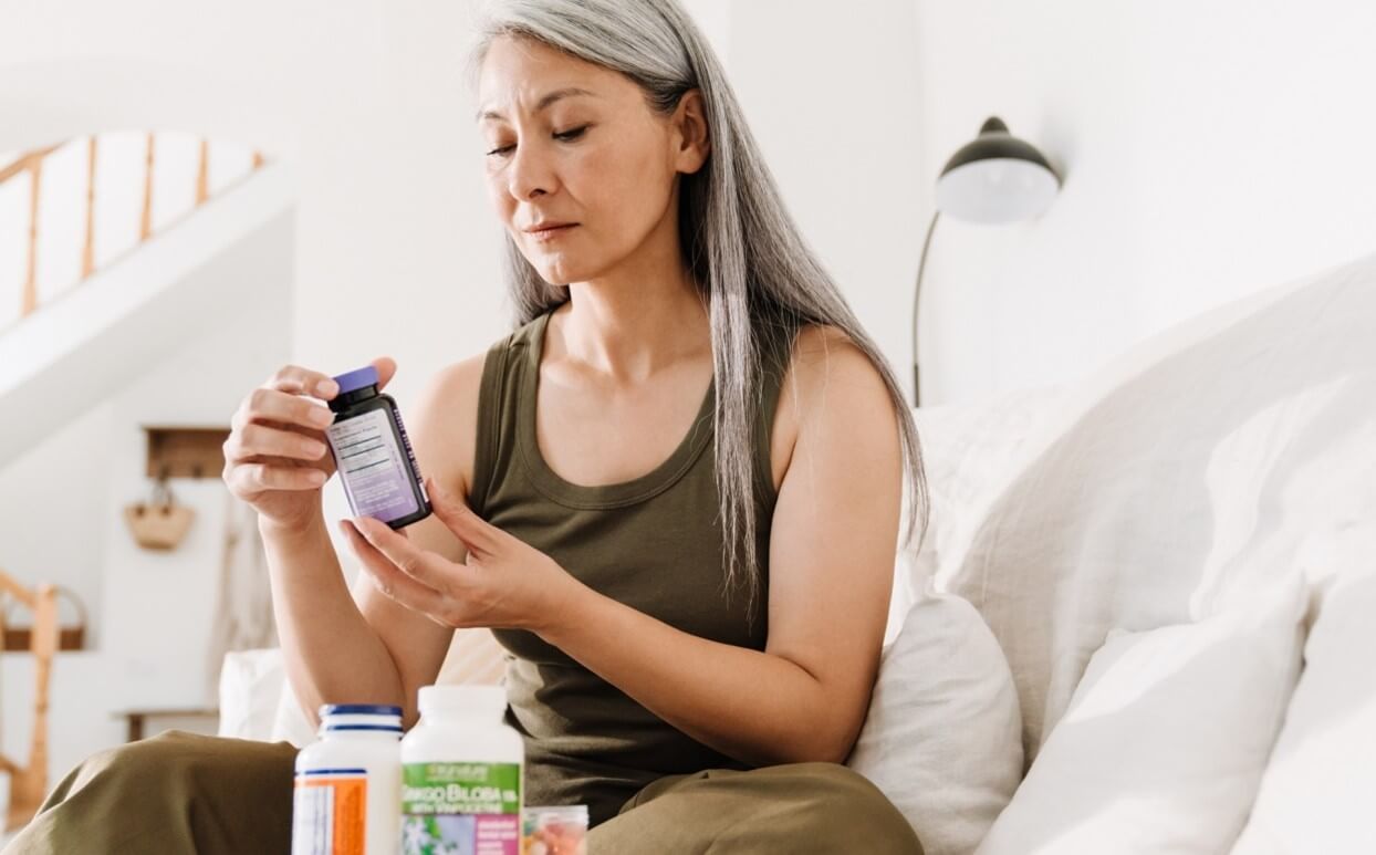 woman holding supplements