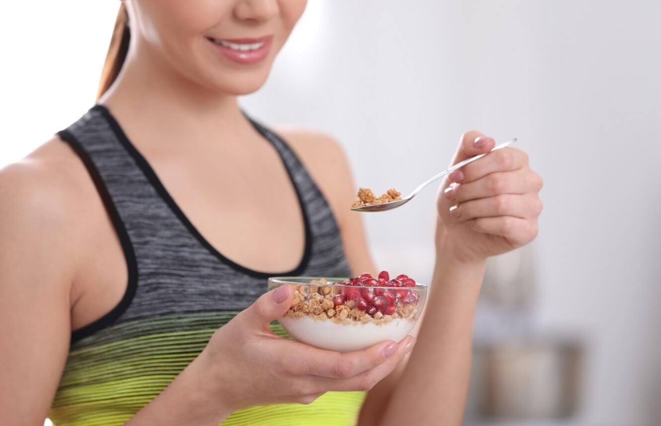 woman eating yogurt