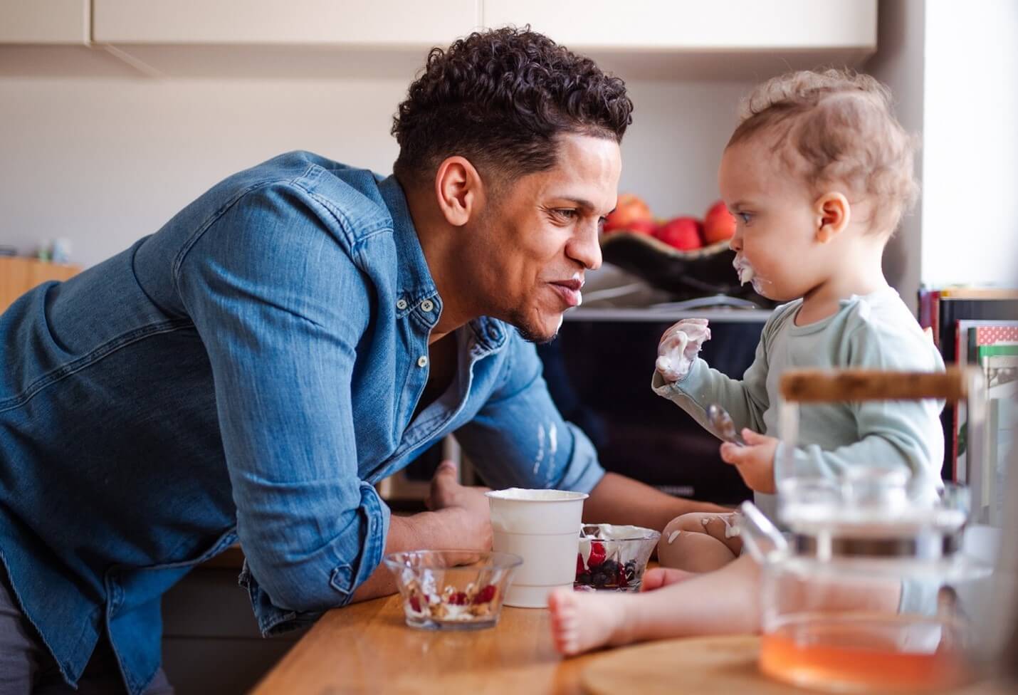 dad and baby eating yogurt