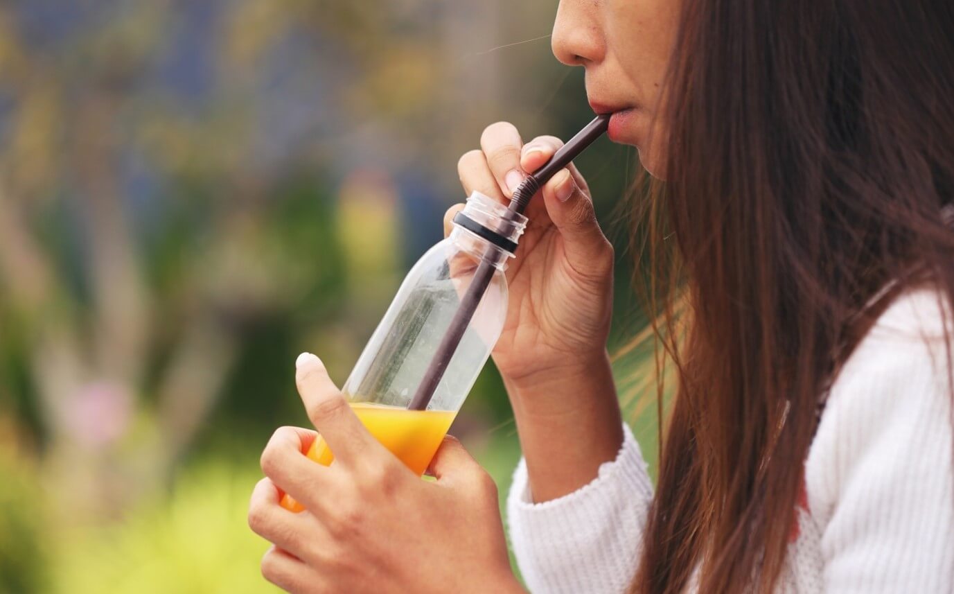 woman drinking juice