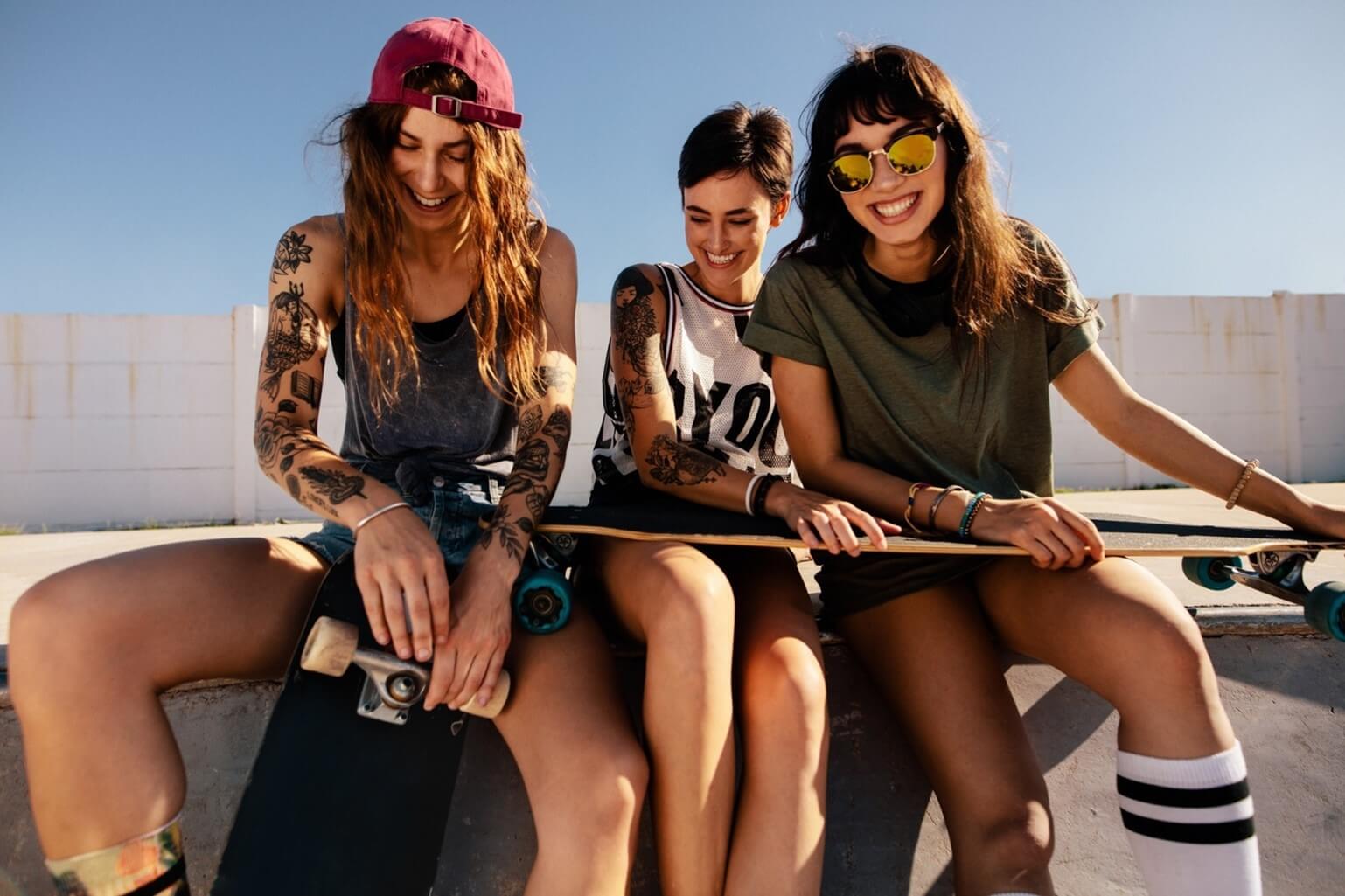 three girls skateboarding