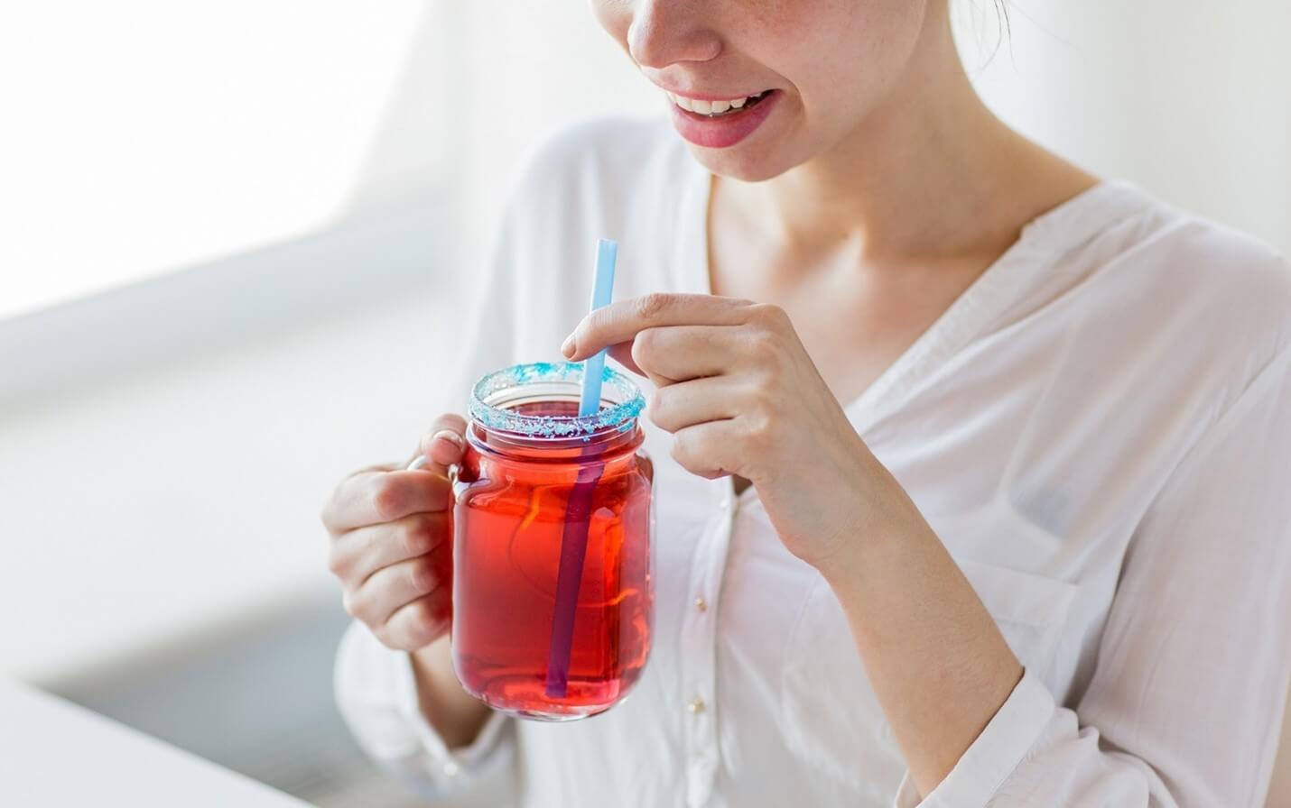 woman with red drink