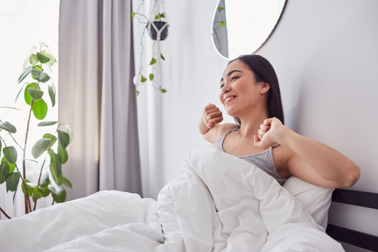 woman getting out of bed