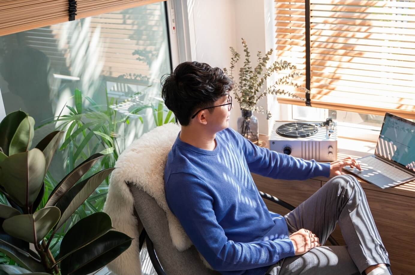 man sitting at computer