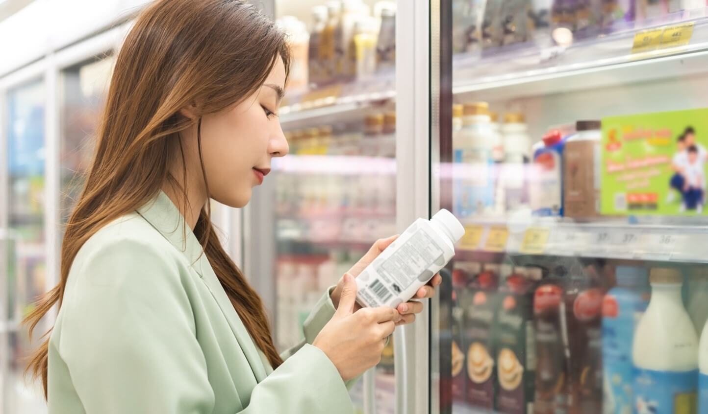 woman looking at beverages in store