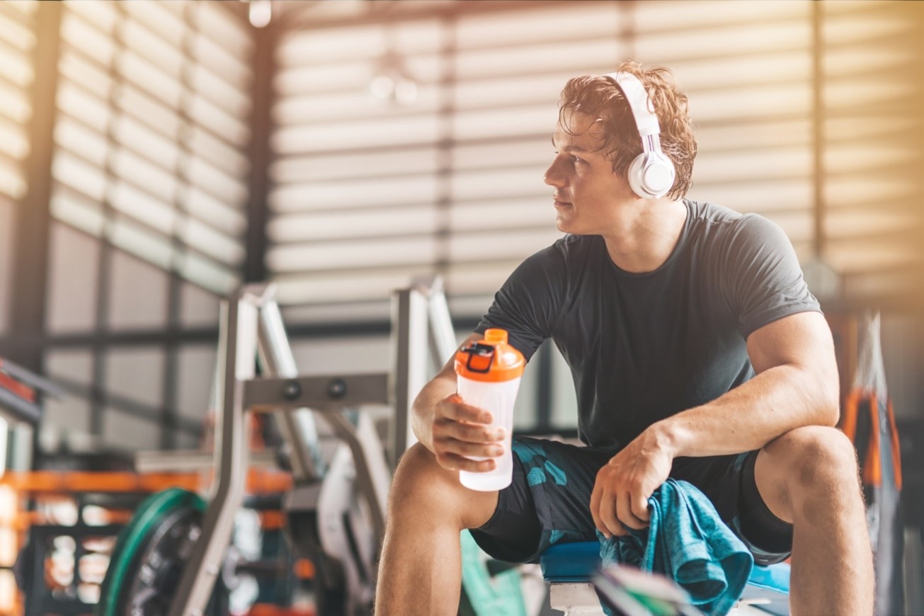 woman with shaker bottle at gym