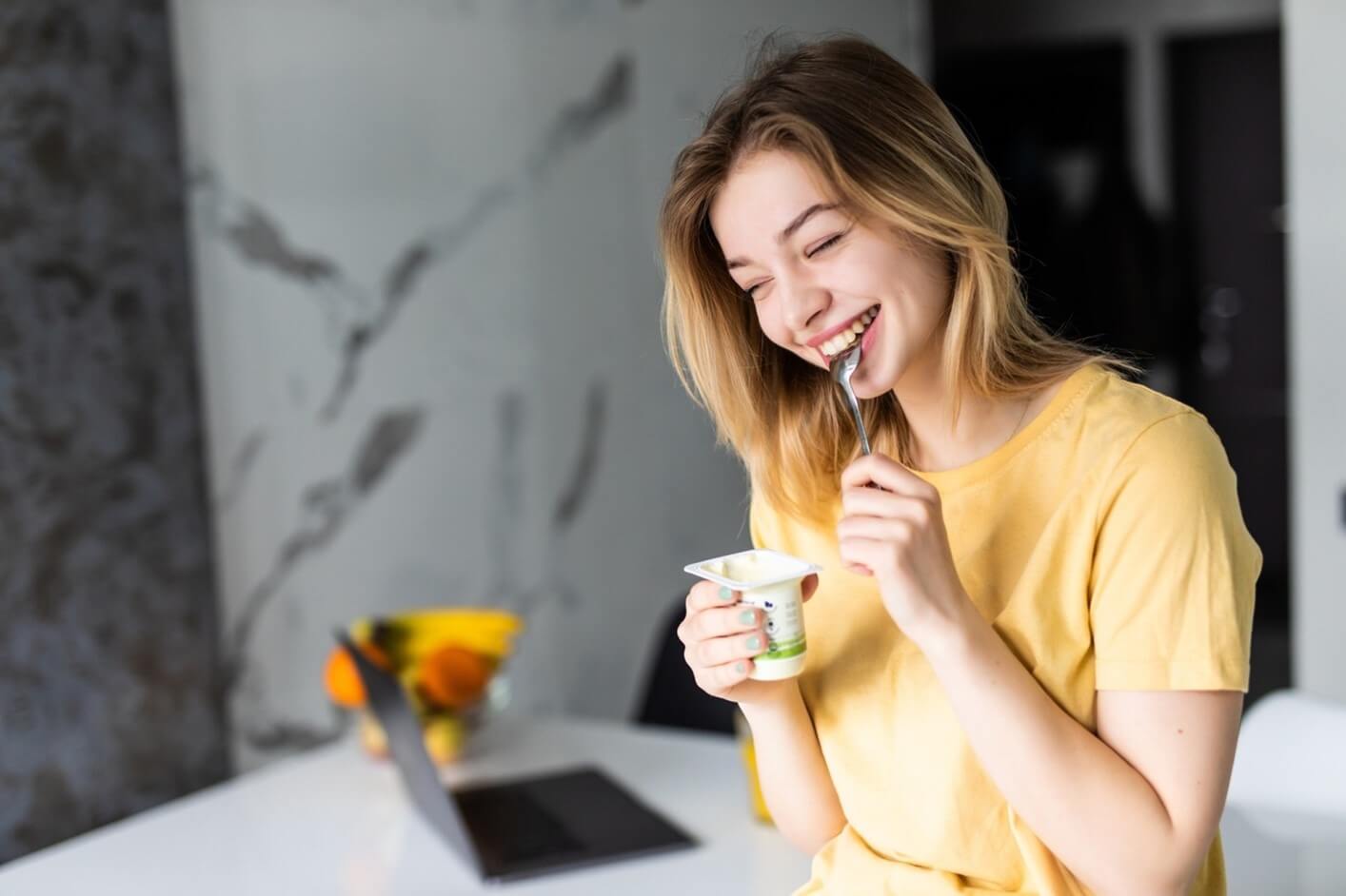 woman eating yogurt